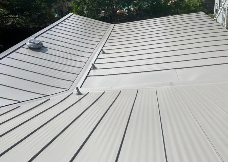 Solar attic fan installed on a metal roof for Roof Ventilation in Lakewood Park